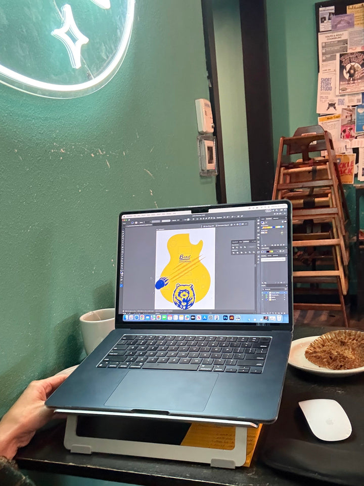 Graphic Designer, Natalia Zanfardino working on a custom guitar build for Bend High School, Oregon